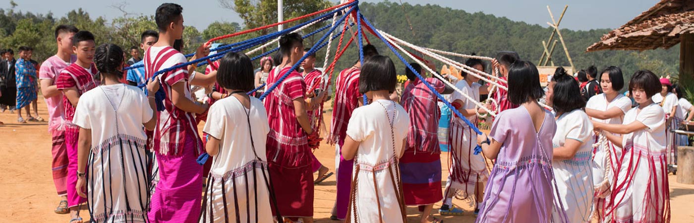 Karen tribal children in traditional clothes performing Karen traditional rope dance in